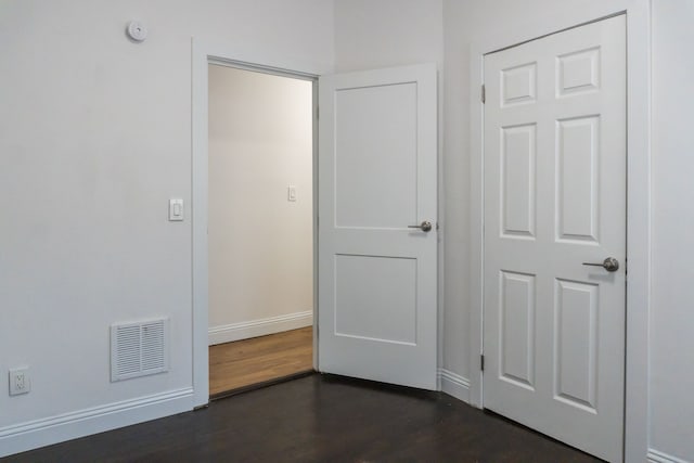 interior space with dark hardwood / wood-style floors