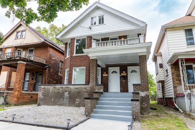 view of front of house featuring a porch and a balcony