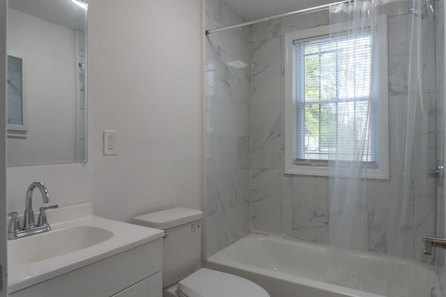 full bathroom with vanity, toilet, and tiled shower / bath