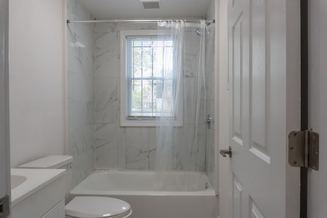 full bathroom with vanity, toilet, and tiled shower / bath