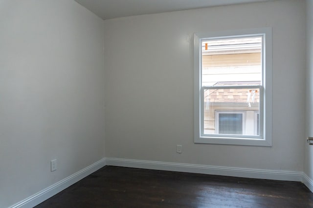 unfurnished room featuring dark hardwood / wood-style flooring