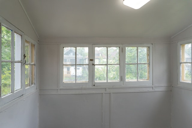 unfurnished sunroom with vaulted ceiling