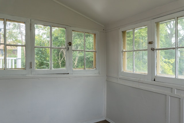 unfurnished sunroom with vaulted ceiling