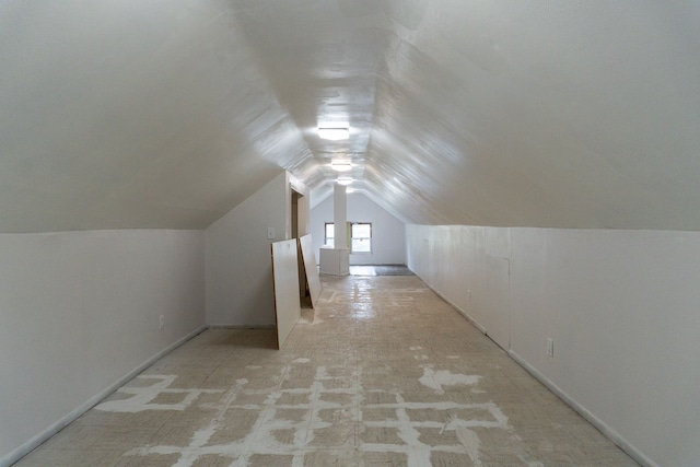 additional living space featuring vaulted ceiling