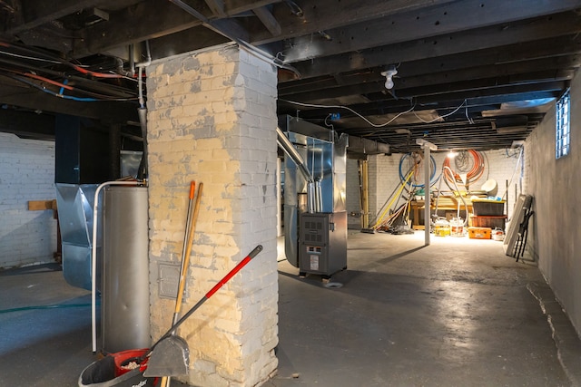 basement featuring water heater and heating unit