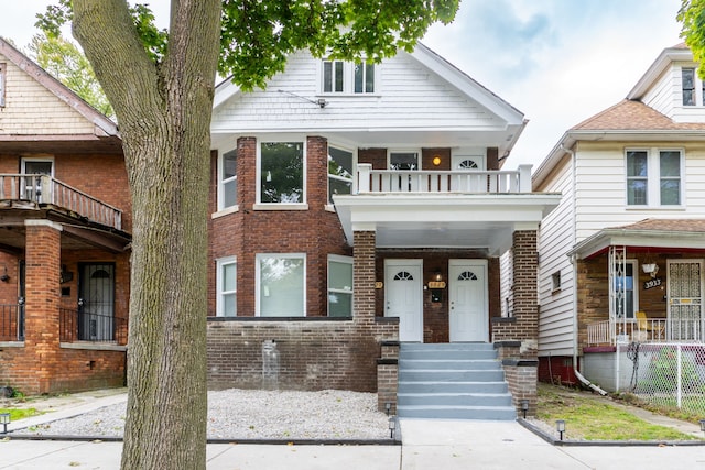 view of front of property with a balcony