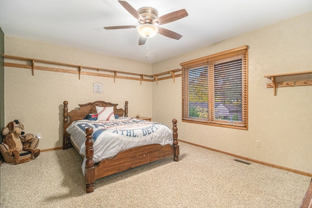 bedroom with ceiling fan and carpet floors