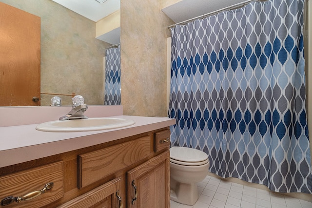 bathroom featuring tile patterned flooring, vanity, and toilet