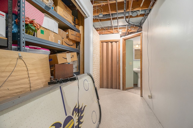 basement with carpet and brick wall