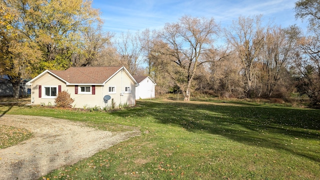 view of property exterior with a lawn