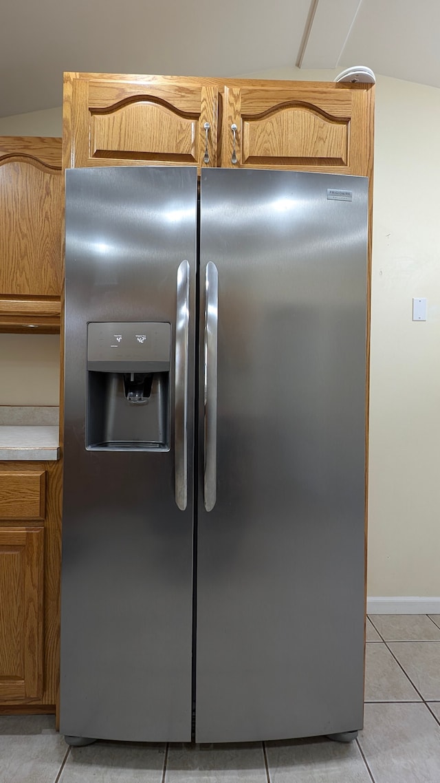 interior details featuring stainless steel fridge with ice dispenser