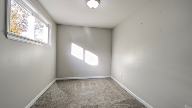 unfurnished room with carpet flooring