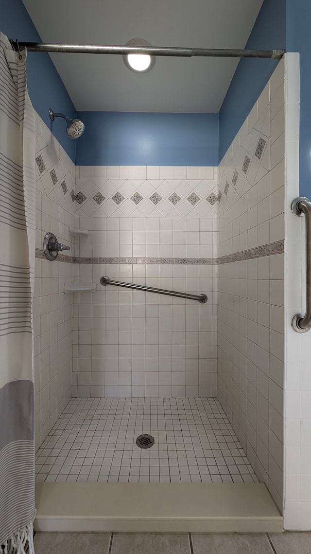 bathroom featuring a shower with shower curtain and tile patterned floors