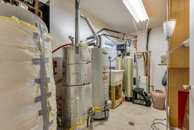 381 S Lorenz Rd, Tawas City, MI 48763 - utility room featuring water heater