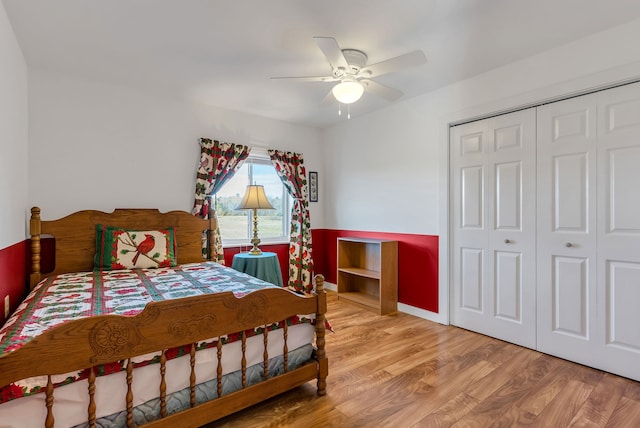 bedroom with wood-type flooring, a closet, and ceiling fan