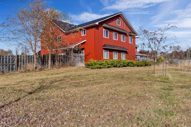 view of home's exterior with a yard