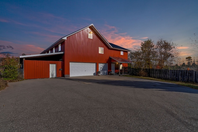 exterior space with a carport and a garage