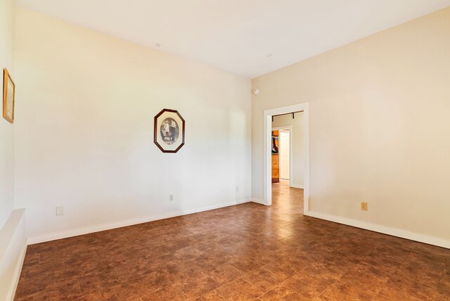 381 S Lorenz Rd, Tawas City, MI 48763 - unfurnished room featuring baseboards