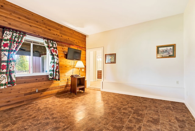 empty room featuring wooden walls