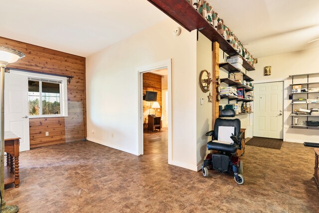 381 S Lorenz Rd, Tawas City, MI 48763 - living area featuring wooden walls and baseboards