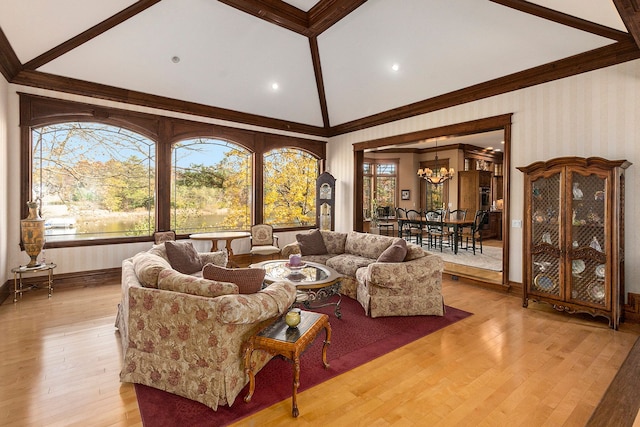 living room featuring a notable chandelier, light wood-type flooring, and lofted ceiling