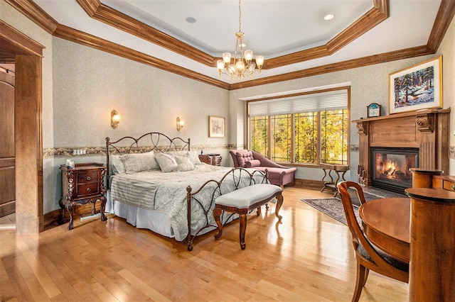 bedroom featuring light wood-type flooring and ornamental molding