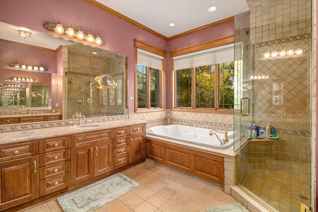 bathroom featuring tile patterned flooring, vanity, ornamental molding, and shower with separate bathtub