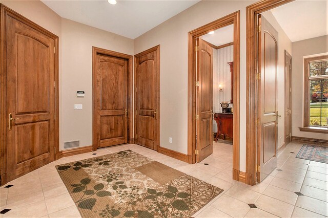 foyer with light tile patterned floors