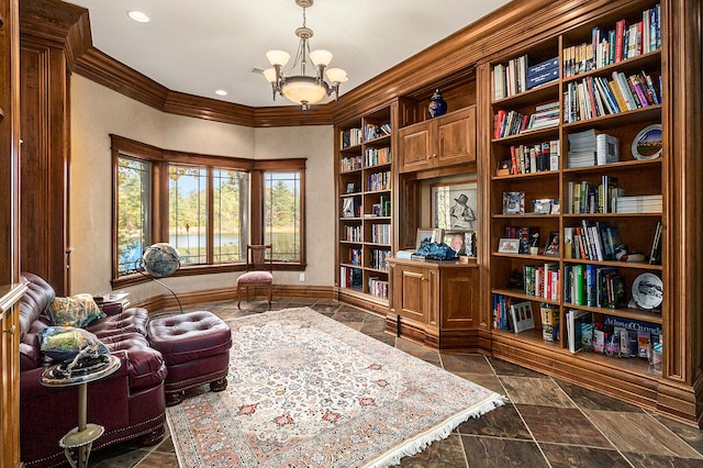 living area with an inviting chandelier and crown molding