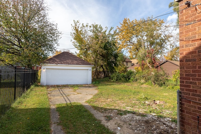 view of yard featuring an outbuilding and a garage