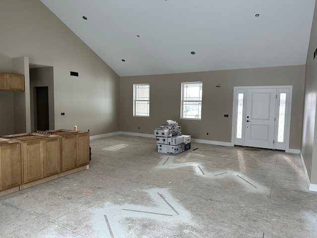 entryway featuring high vaulted ceiling