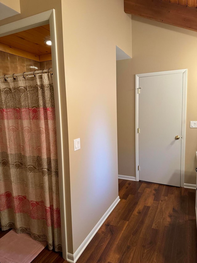bathroom with hardwood / wood-style floors and wood ceiling