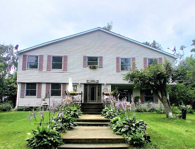 view of front of house with a front lawn