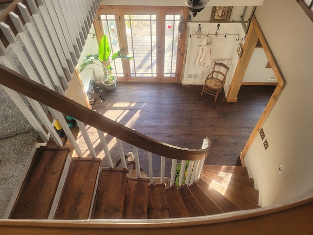 stairway with hardwood / wood-style floors