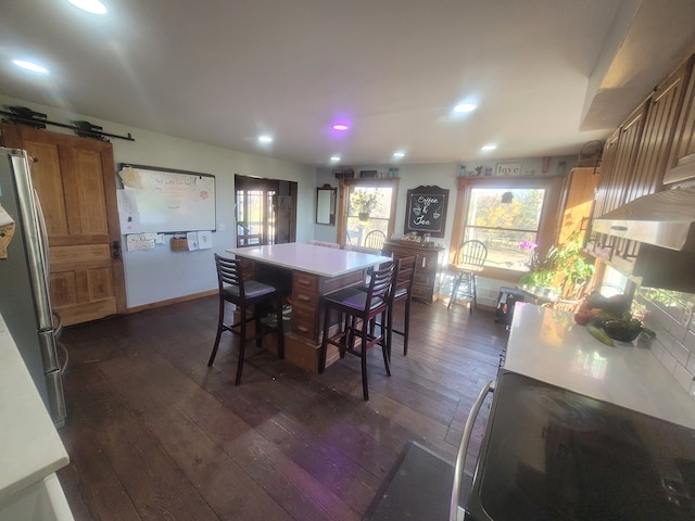 dining space featuring dark wood-type flooring