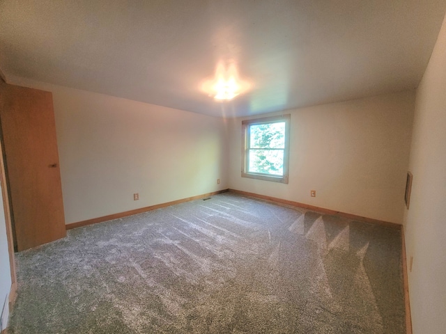 spare room featuring carpet flooring