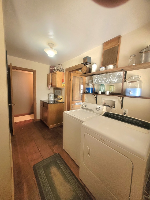 clothes washing area featuring dark wood-type flooring and independent washer and dryer