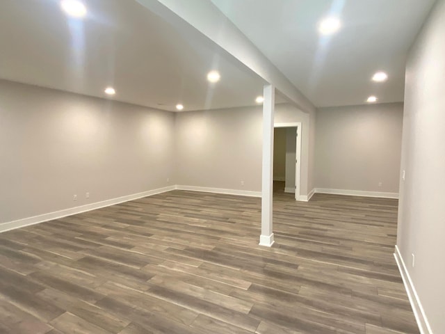 basement featuring dark hardwood / wood-style floors