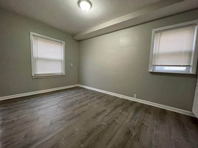 empty room with dark wood-type flooring