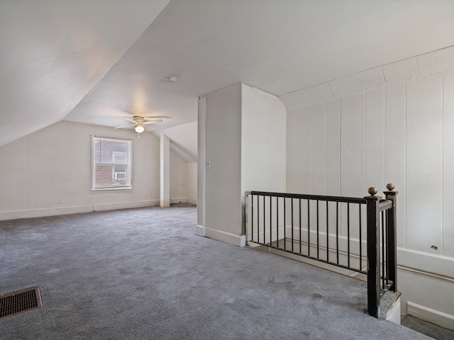 additional living space featuring carpet flooring, ceiling fan, and lofted ceiling