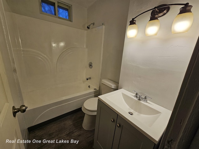 full bathroom with toilet, vanity, shower / bathing tub combination, and hardwood / wood-style floors