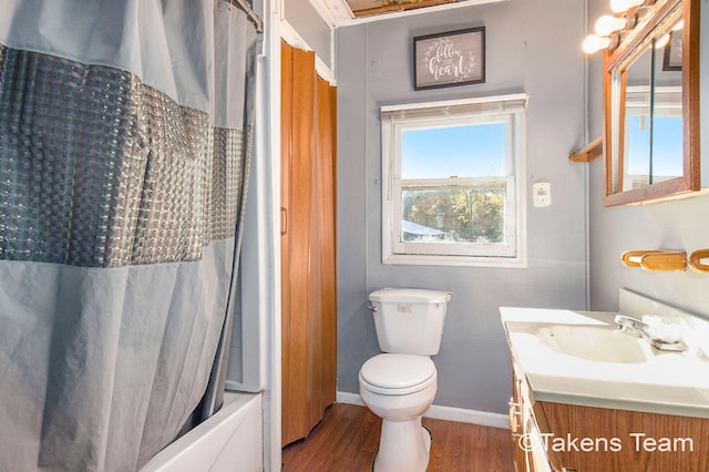 full bathroom with vanity, toilet, wood-type flooring, and shower / bath combo