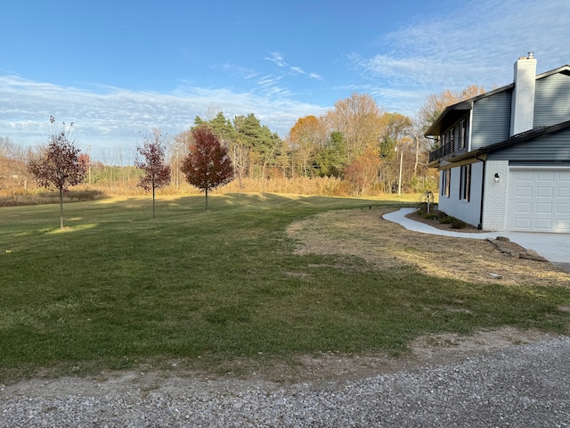 view of yard featuring a garage