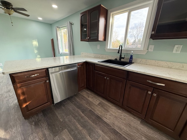 kitchen with dark hardwood / wood-style flooring, stainless steel dishwasher, a wealth of natural light, and sink