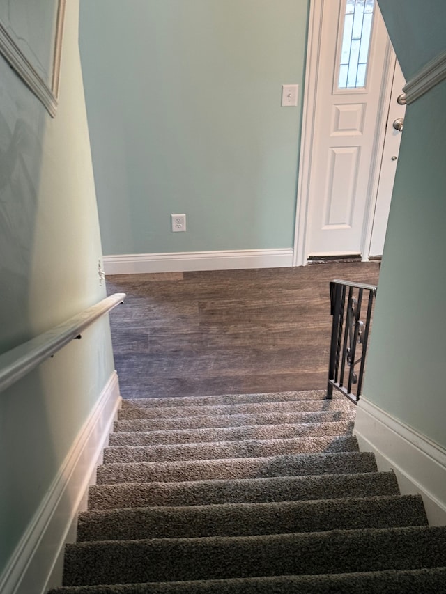 stairway with wood-type flooring