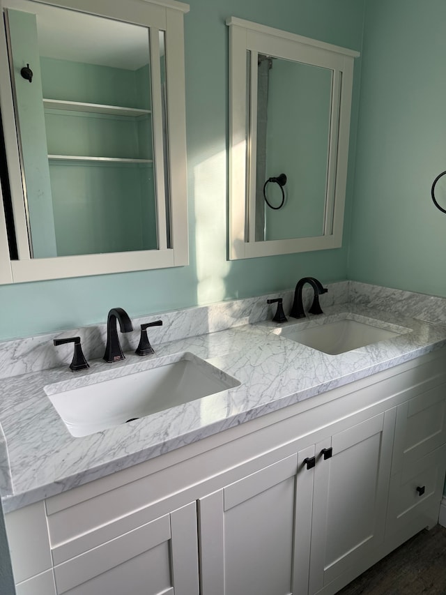 bathroom featuring hardwood / wood-style floors and vanity