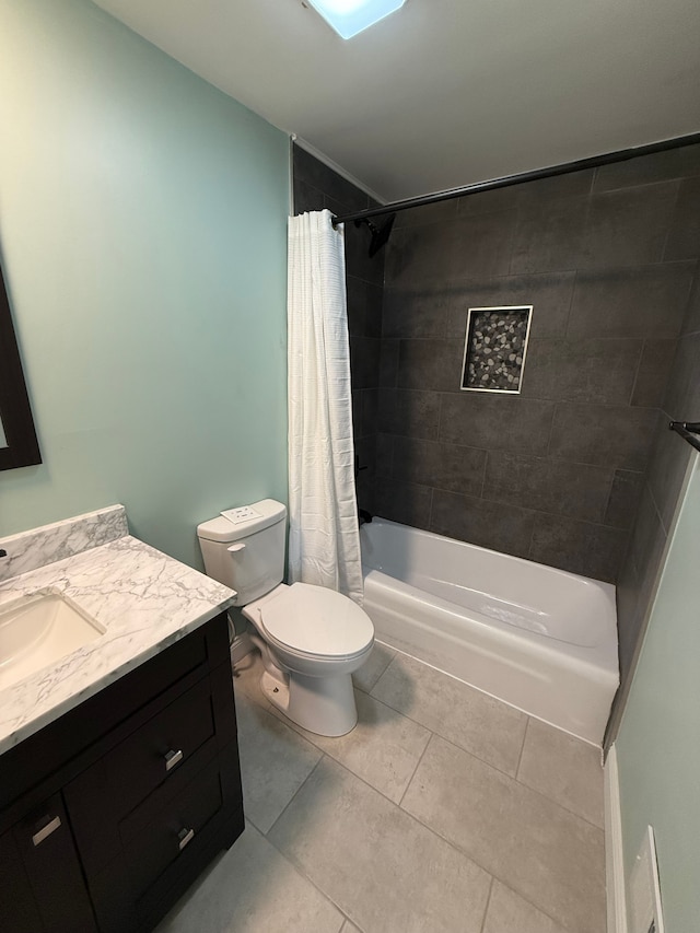 full bathroom featuring tile patterned flooring, vanity, toilet, and shower / bathtub combination with curtain