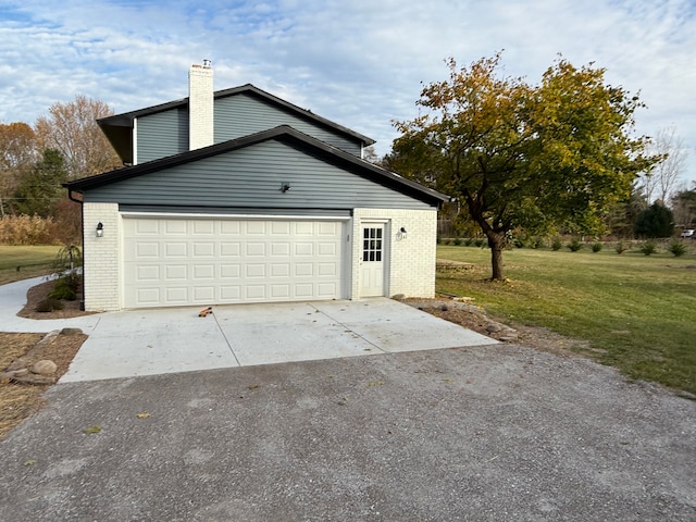 garage with a yard