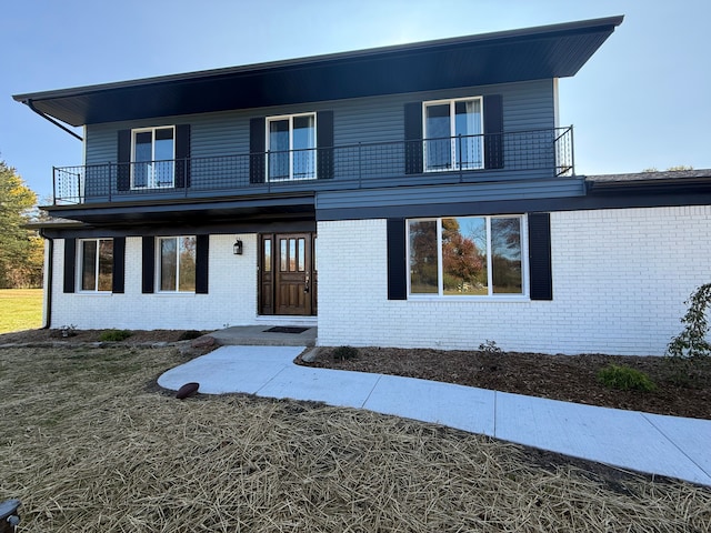 view of property with a balcony