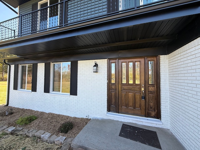 entrance to property with a balcony